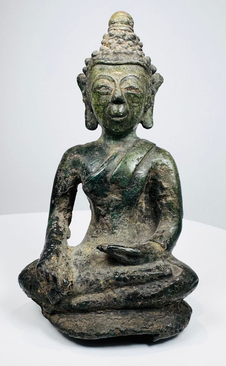Front view of a Lan Na bronze Buddha seated in the earth-touching gesture