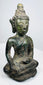 Angled view of the antique Thai bronze Buddha in maravijaya posture