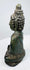 Side view of the hollow-cast Thai bronze Buddha with aged verdigris patina