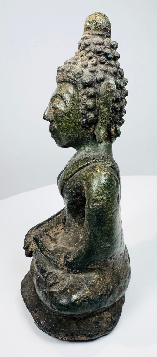 Side profile of the seated Shakyamuni Buddha with elongated earlobes