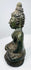 Side profile of the seated Shakyamuni Buddha with elongated earlobes