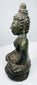 Side profile of the seated Shakyamuni Buddha with elongated earlobes