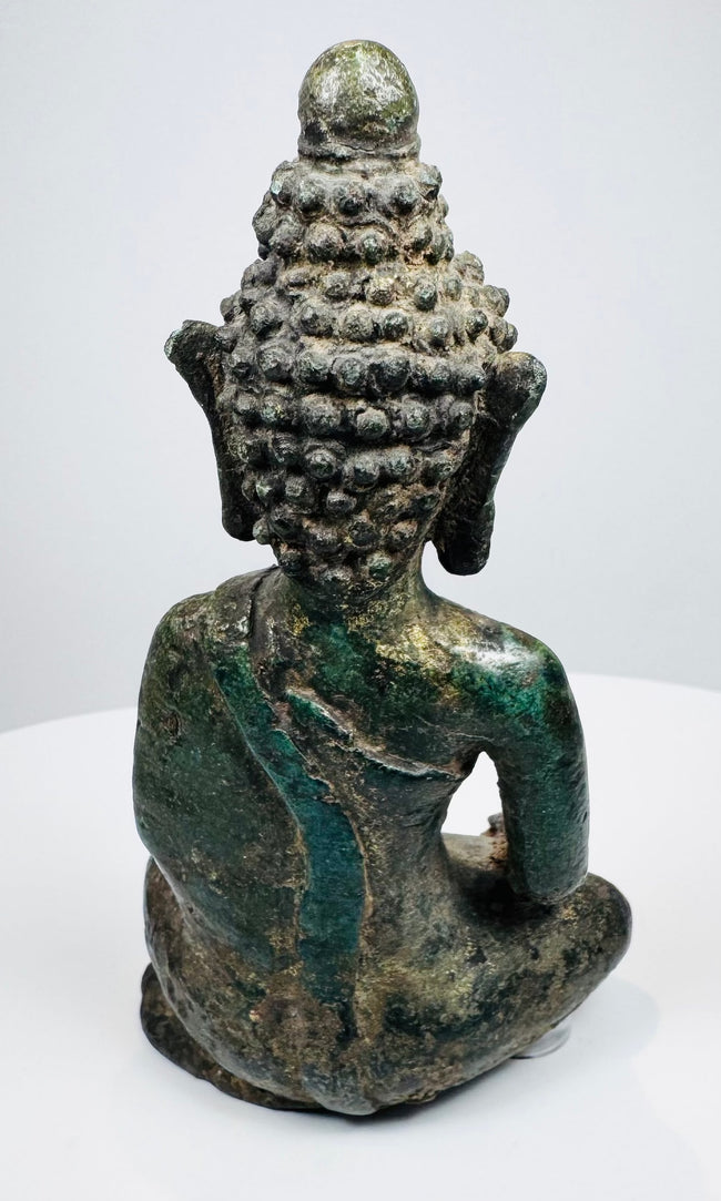 Rear view of the Lan Na Buddha showing tiered snail-shell hair curls