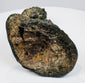 Open underside of the lost-wax cast Buddha showing accretions and casting-core remnants