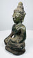 Three-quarter view of the Northern Thai Buddha with brown and green patina