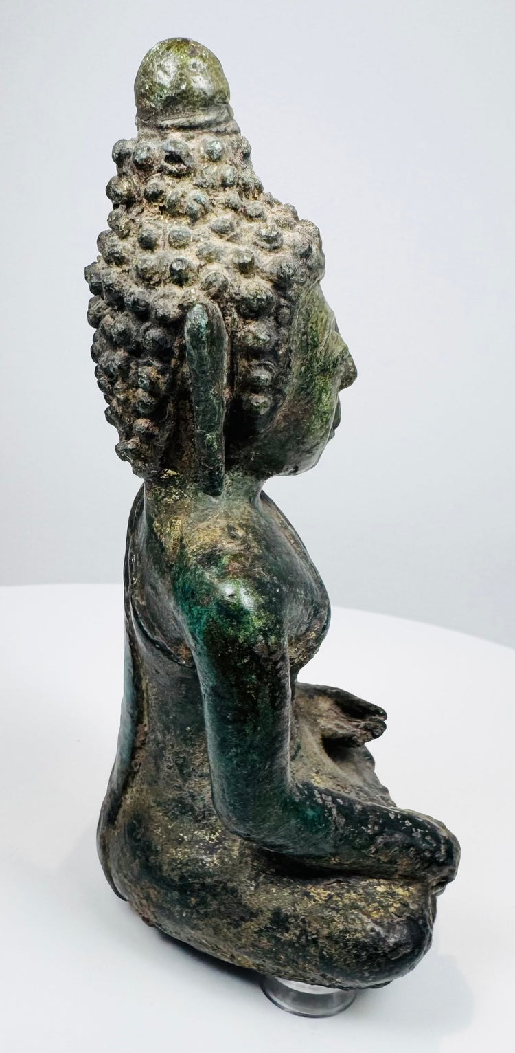 Opposite profile of the seated Lan Na Buddha showing its compact proportions