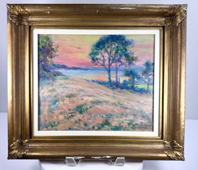 Black Rock, Bay of Fundy oil painting in an ornate gold-toned frame, depicting trees beneath a pink and yellow sky.