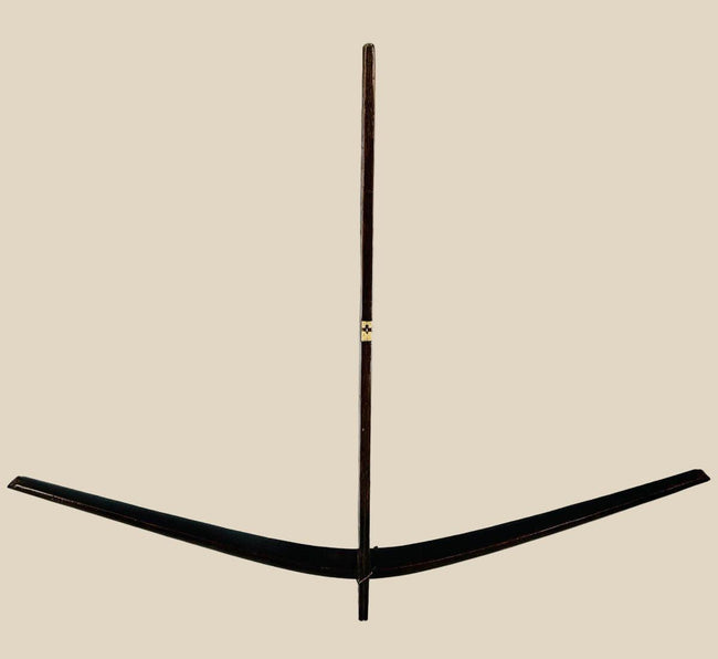 Antique Nu tribal crossbow from Yunnan, China, crafted from mulberry wood with hand-carved bone toggles and aged patina, dating to the Late Qing to early 20th century.