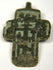 Close-up of green and black champlevé enamel details on antique cross