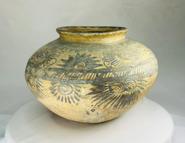 Close-up of radiating geometric designs on an Otomí-style terracotta water jar