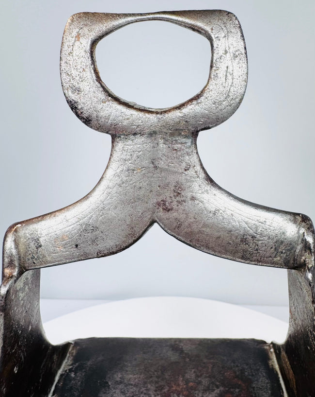 Ottoman military stirrup from the 1600s with floral openwork footplate and decorative silver damascene remnants.