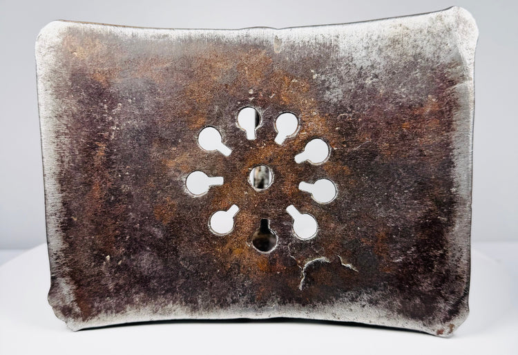 Early modern Ottoman stirrup showing dark steel patina, openwork floral ornament, and traces of luxury silver decoration.