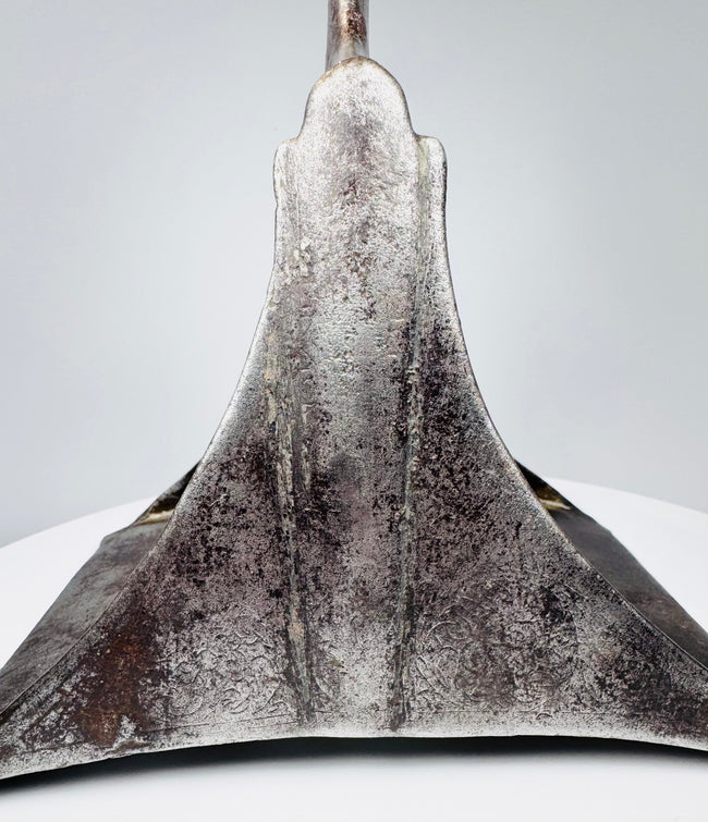 Historic Ottoman Empire steel stirrup featuring a broad arch, pierced tread, and age-related oxidation.