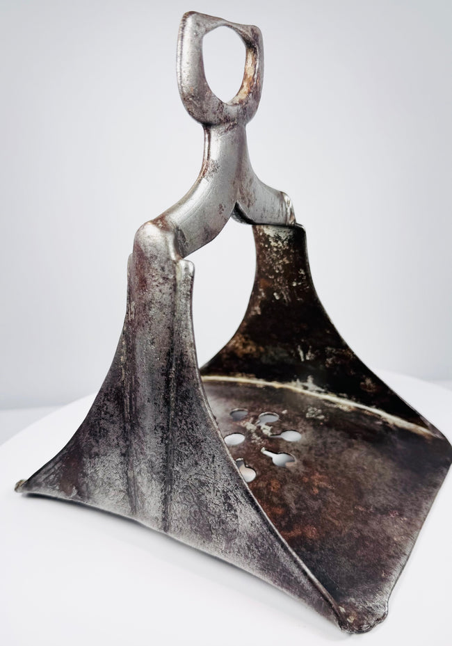 Antique Ottoman cavalry stirrup in forged steel with openwork decoration and surviving silver inlay.