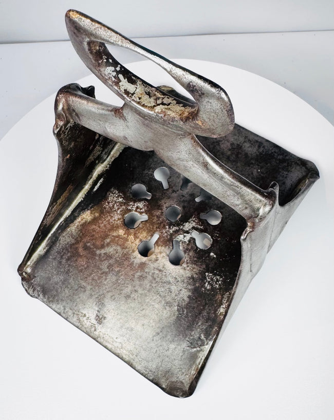 17th-century Ottoman horse stirrup with sturdy triangular construction, wide saddle loop, and decorative pierced base.