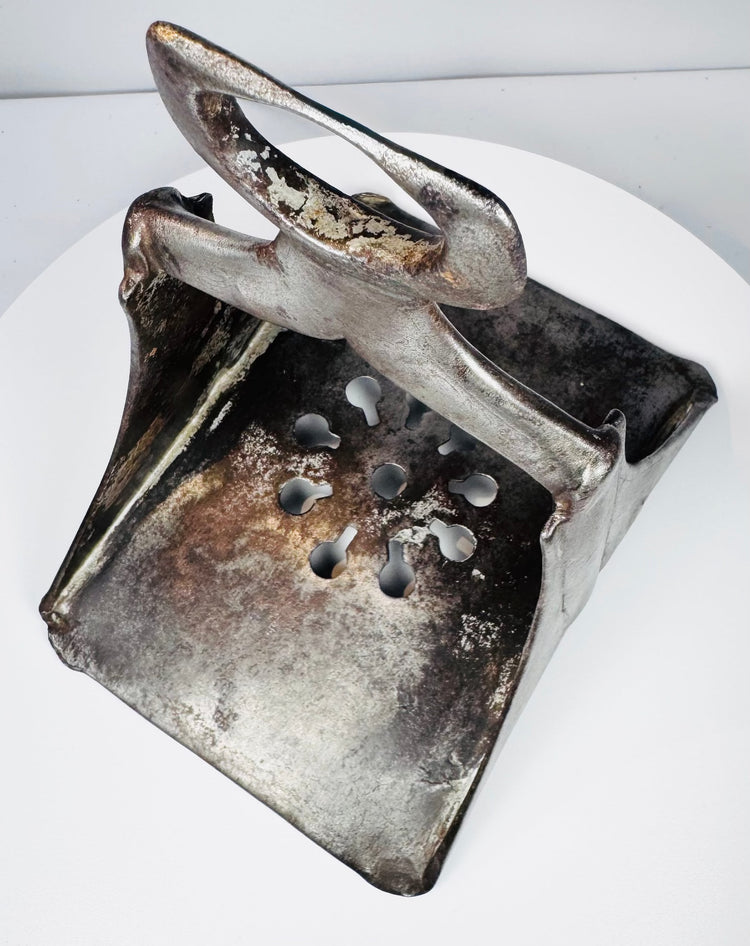 17th-century Ottoman horse stirrup with sturdy triangular construction, wide saddle loop, and decorative pierced base.