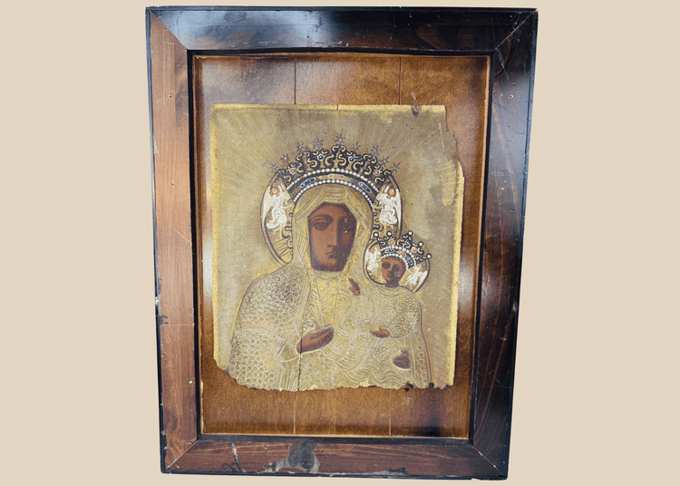 19th-century Eastern European icon depicting Our Lady of Częstochowa holding the Christ Child beneath an ornate metal riza.