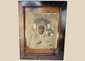 19th-century Eastern European icon depicting Our Lady of Częstochowa holding the Christ Child beneath an ornate metal riza.
