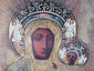 Historic Christian devotional icon mounted in a shadowbox frame with richly decorated metal riza and angelic motifs.
