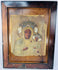 Black Madonna devotional icon with embossed metal revetment, jeweled crowns, and decorative halo motifs.