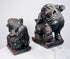 Opposite side view of Chinese guardian lions showing mirrored poses, brocade balls and surviving red polychrome decoration