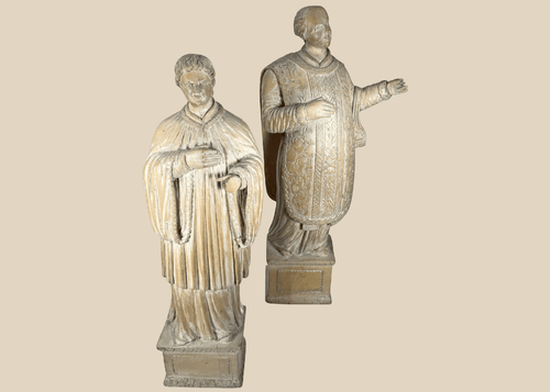 Pair of antique hand-carved European religious figures depicting saintly and ecclesiastical subjects.