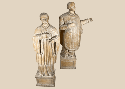 Pair of antique hand-carved European religious figures depicting saintly and ecclesiastical subjects.