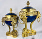 Antique French decorative vases with cobalt-blue porcelain, openwork gilt bronze galleries, and pinecone finials.