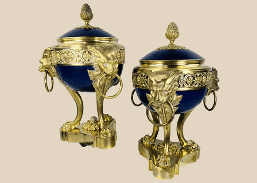 Pair of Louis XVI Revival covered vases with gilt bronze ormolu mounts and cobalt-blue porcelain bodies.