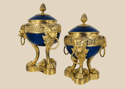 Pair of Louis XVI Revival covered vases with gilt bronze ormolu mounts and cobalt-blue porcelain bodies.