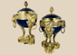 Pair of Louis XVI Revival covered vases with gilt bronze ormolu mounts and cobalt-blue porcelain bodies.