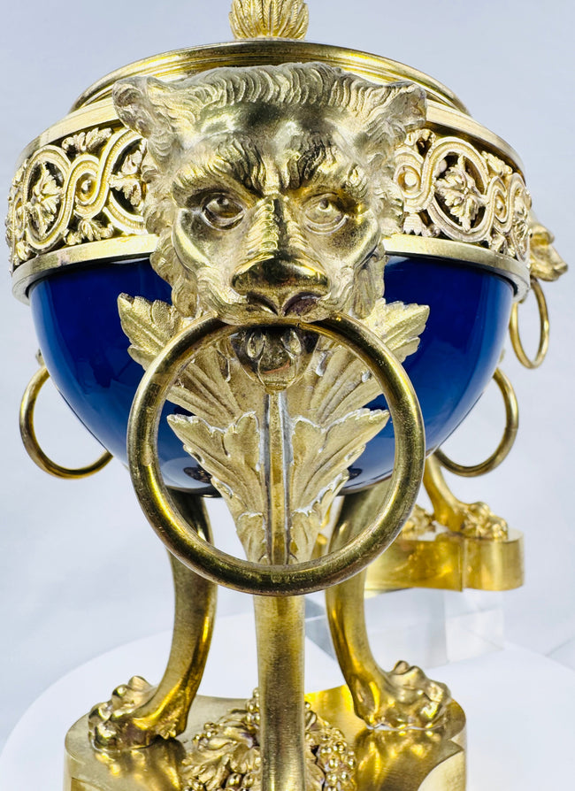 Antique Louis XVI Revival vase showcasing deep cobalt-blue porcelain and ornate gilt bronze detailing.