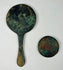 Pair of Chinese bronze mirrors with natural aged patina and relief designs