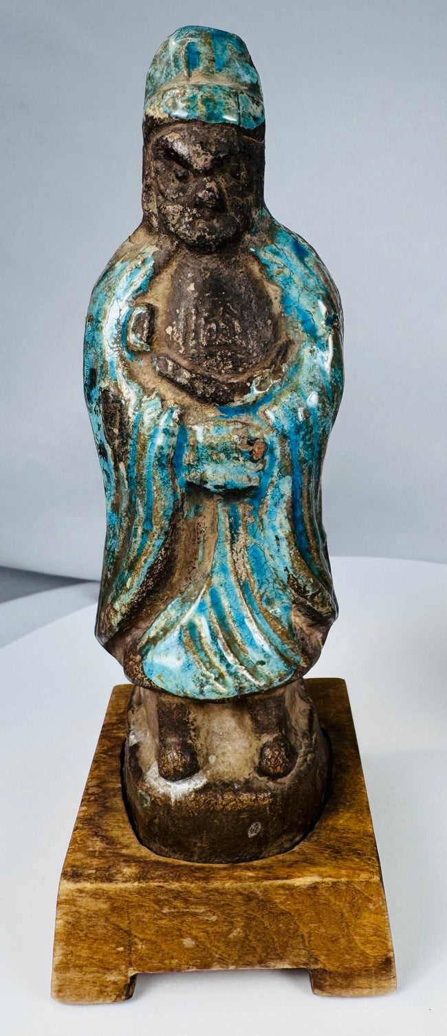 Turquoise-glazed Chinese pottery figures with dark aubergine surfaces and aged patina