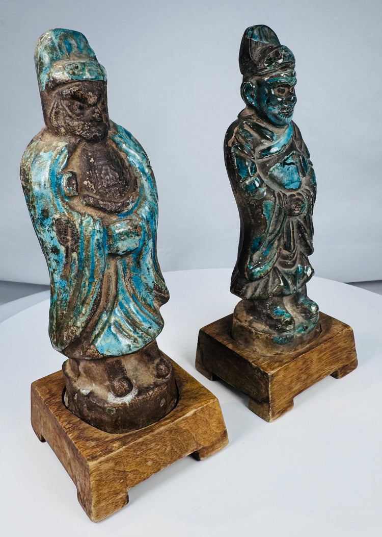 Pair of Chinese fahua-style pottery officials mounted on wooden display bases