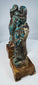 Antique Asian pottery figure pair displaying turquoise glaze loss and surface craquelure