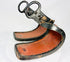 Pair of antique Japanese lacquered samurai stirrups with curved red interiors and black lacquered exteriors, Edo–Meiji period craftsmanship, displayed on a white background.