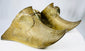 Cast brass equestrian slipper stirrups with triangular drainage openings and strap bars intact.