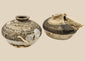 Pair of Ming dynasty discoid stoneware jarlets recovered from a Philippine shipwreck, 15th–16th century CE. Partial brown glaze with barnacle and mussel encrustations. One jarlet bears National Museum of the Philippines label. Excellent maritime provenance and well-preserved condition.
