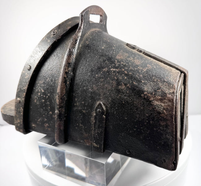Interior view of antique hooded stirrup showing wooden tread and surviving leather lining