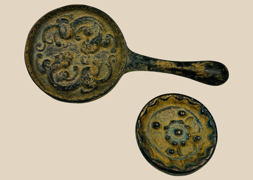 Pair of antique Chinese bronze hand mirrors from the Qing Dynasty