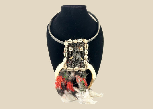 20th century Papua New Guinea tribal ceremonial necklace, braided plant fiber with shell and bone elements, red and black feathers, Oceanic ritual ornament, mounted for display