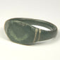 Side view of ancient Roman bronze finger ring with rounded hoop and expanding shoulders, US size 9