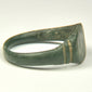 Underside of Roman bronze finger ring with complete rounded hoop and naturally aged archaeological surface