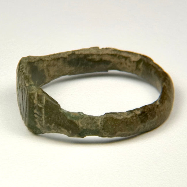 Late Roman engraved bronze ring with rectangular-to-trapezoidal face and decorated shoulders