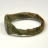 Late Roman engraved bronze ring with rectangular-to-trapezoidal face and decorated shoulders