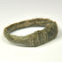 Late Roman bronze ring with letter-like engraved marks and geometric shoulder decoration