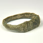 Late Roman bronze ring with letter-like engraved marks and geometric shoulder decoration