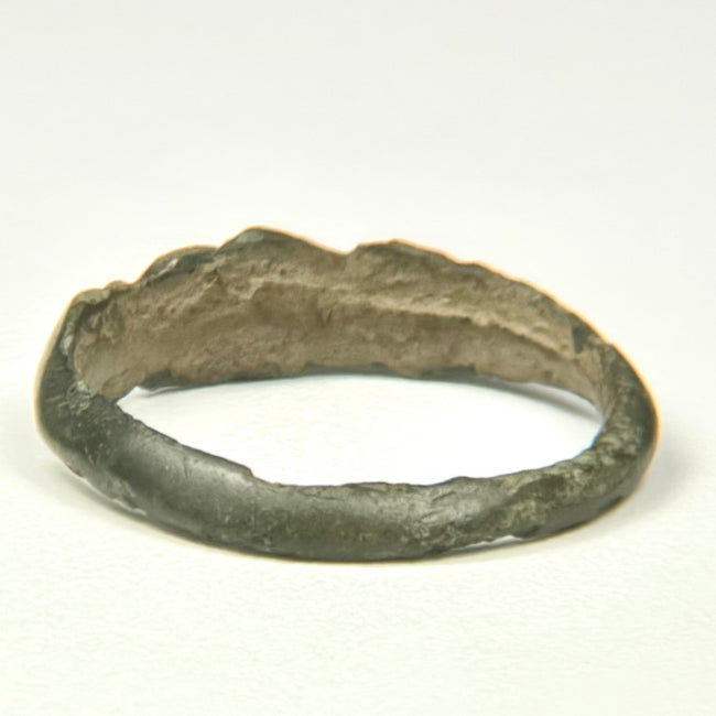 Early Byzantine bronze finger ring with dark olive-brown patina and simple incised decoration