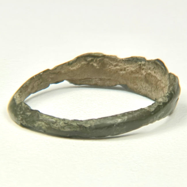 Ancient Eastern Mediterranean bronze ring with broad flattened face and parallel diagonal grooves
